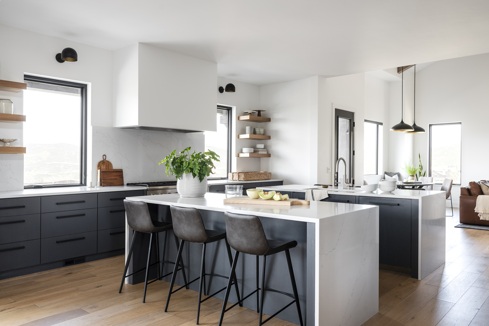 Large open concept kitchen in modern farmhouse with white oak floors