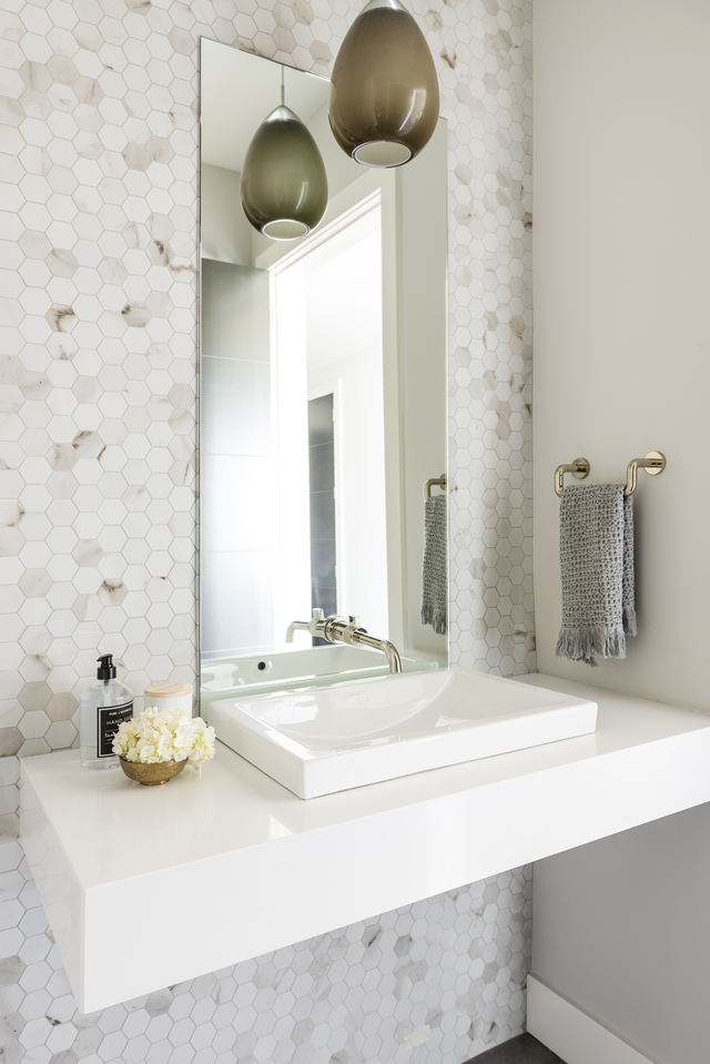 Powder bathroom with floating countertop
